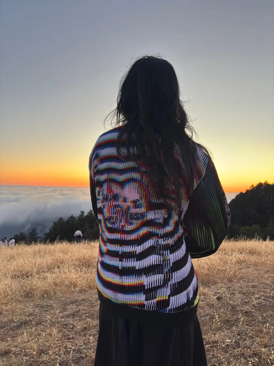 Close view of the jacket back, the image shifting across the ribbed lenticular surface.